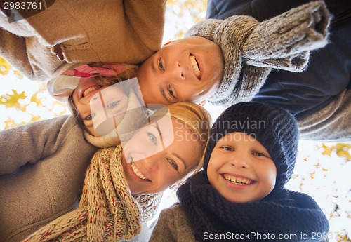 Image of happy family in autumn park