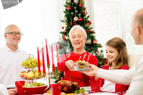 Image of smiling family having holiday dinner at home