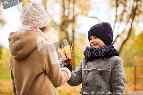 Image of smiling children in autumn park