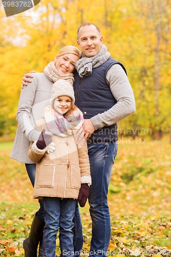 Image of happy family in autumn park