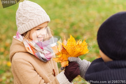 Image of smiling children in autumn park