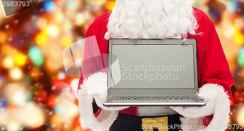 Image of close up of santa claus with laptop