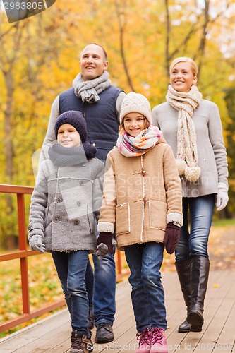 Image of happy family in autumn park