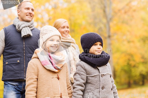 Image of happy family in autumn park