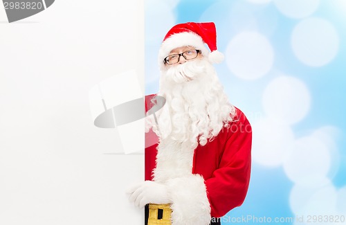 Image of man in costume of santa claus with billboard