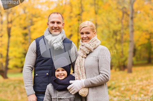 Image of happy family in autumn park