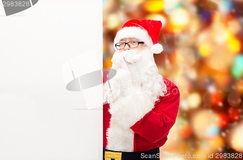 Image of man in costume of santa claus with billboard