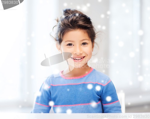 Image of smiling little girl indoors