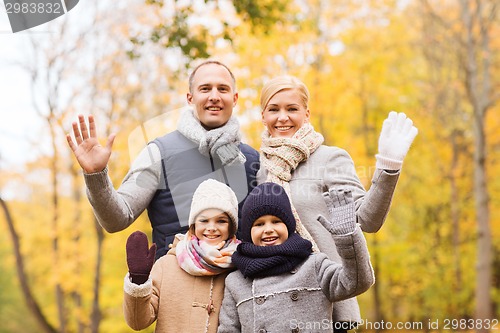 Image of happy family in autumn park