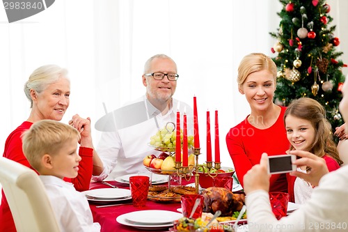 Image of smiling family having holiday dinner at home
