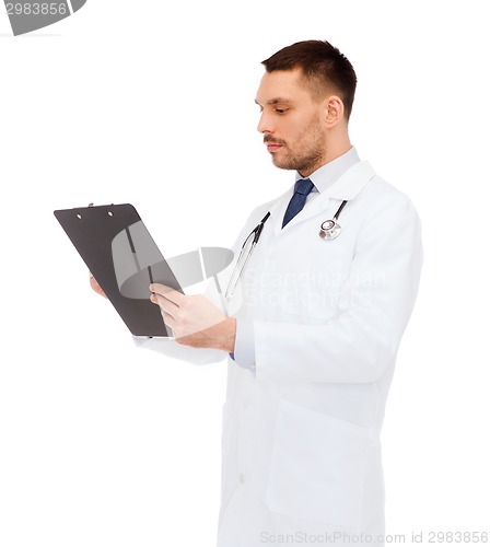Image of serious male doctor with clipboard and stethoscope
