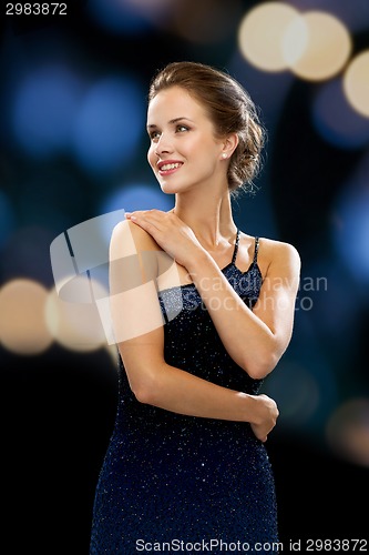 Image of smiling woman in evening dress