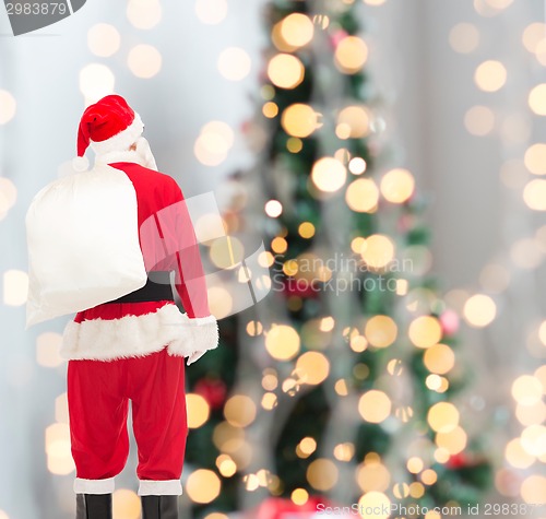 Image of man in costume of santa claus with bag