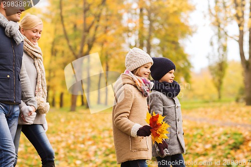 Image of happy family in autumn park