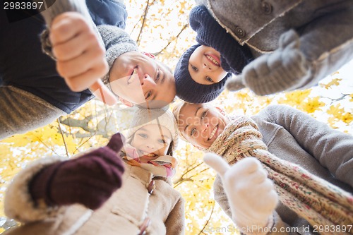 Image of happy family in autumn park