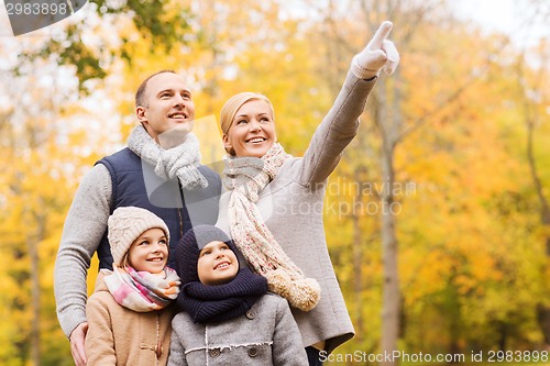 Image of happy family in autumn park