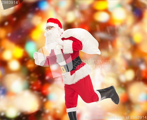 Image of man in costume of santa claus with bag