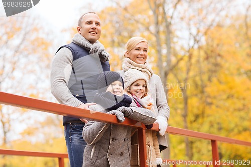 Image of happy family in autumn park