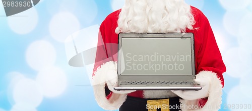 Image of close up of santa claus with laptop