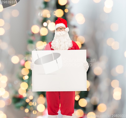 Image of man in costume of santa claus with billboard