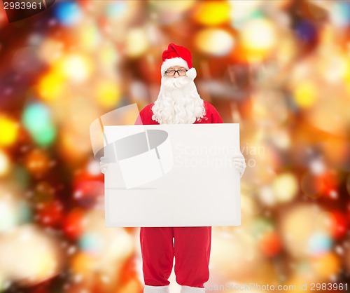 Image of man in costume of santa claus with billboard