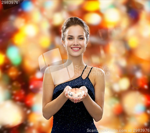 Image of smiling woman in evening dress with diamond