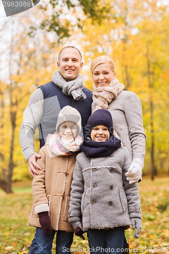 Image of happy family in autumn park