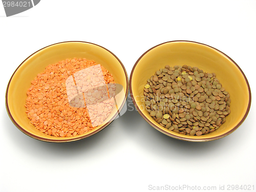 Image of Two bowls of ceramic with lentils and red lentils