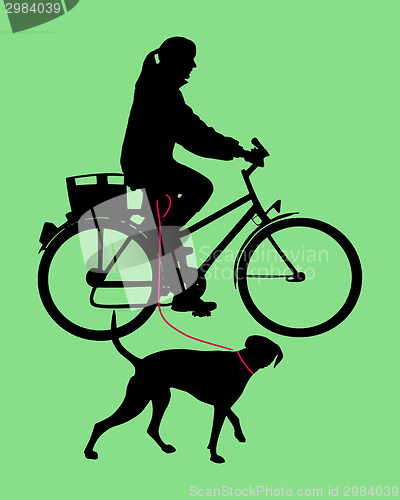 Image of Woman on bicycle with dog on leash