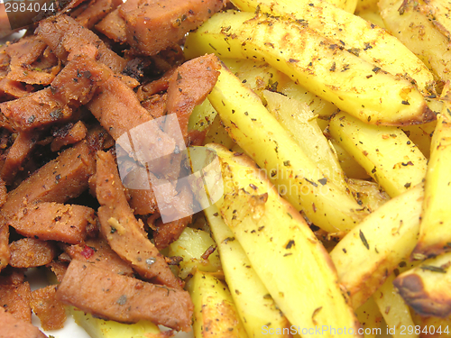 Image of Soy Geschnetzeltes and french fries als background picture