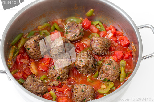 Image of Meatballs cooking in a sauce