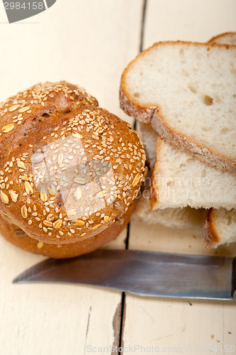 Image of organic bread over rustic table