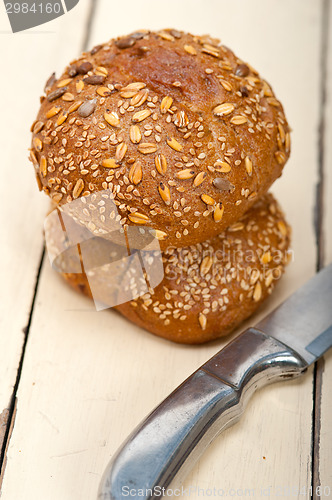 Image of organic bread over rustic table