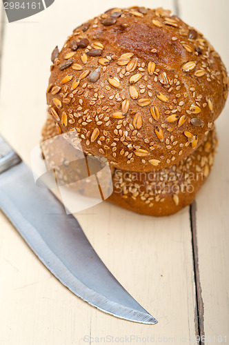 Image of organic bread over rustic table