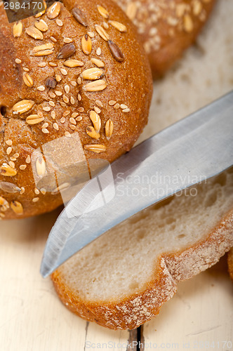 Image of organic bread over rustic table