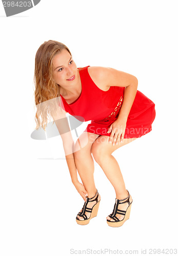 Image of Woman fixing her heels.