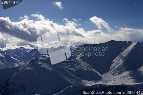 Image of Silhouette of winter mountains at evening