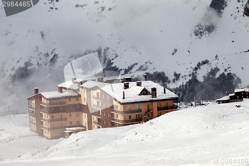 Image of Hotel and ski slope at fog day