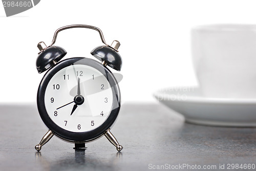 Image of Alarm clock with cup of coffee