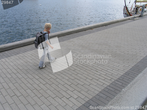 Image of Seven years old on his way from school.