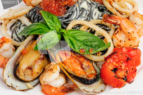 Image of Black Pasta with sea food and basil