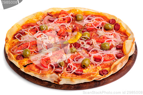 Image of two whole pizzas on wooden table