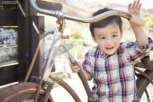Image of Mixed Race Young Boy Having Fun on the Bicycle
