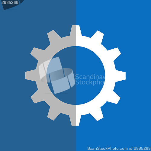 Image of White gearwheel on blue background