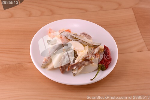 Image of Healthy salad with fresh vegetables on wooden background