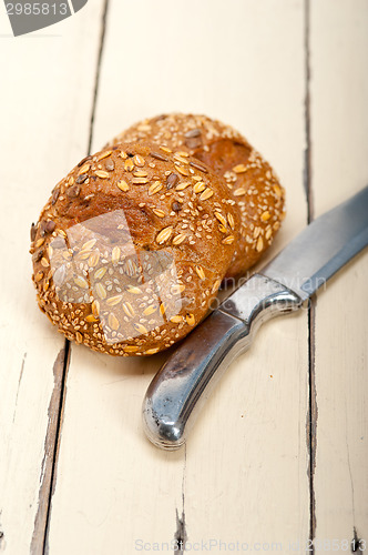 Image of organic bread over rustic table