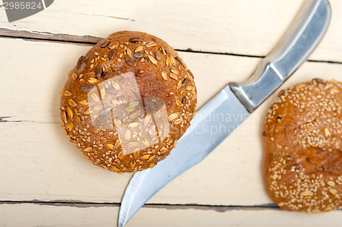 Image of organic bread over rustic table