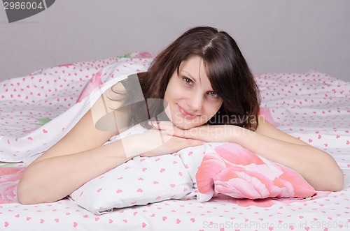 Image of Young girl a great mood in bed