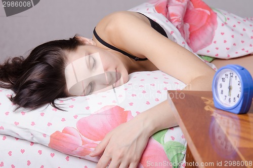 Image of Girl asleep at six clock