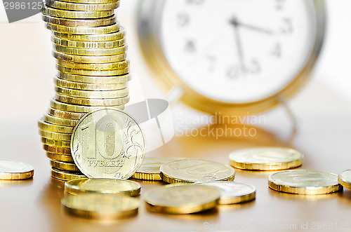 Image of Alarm clock and money